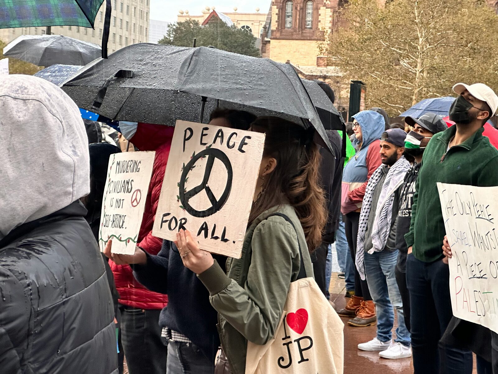 Crowd with signs in a public square