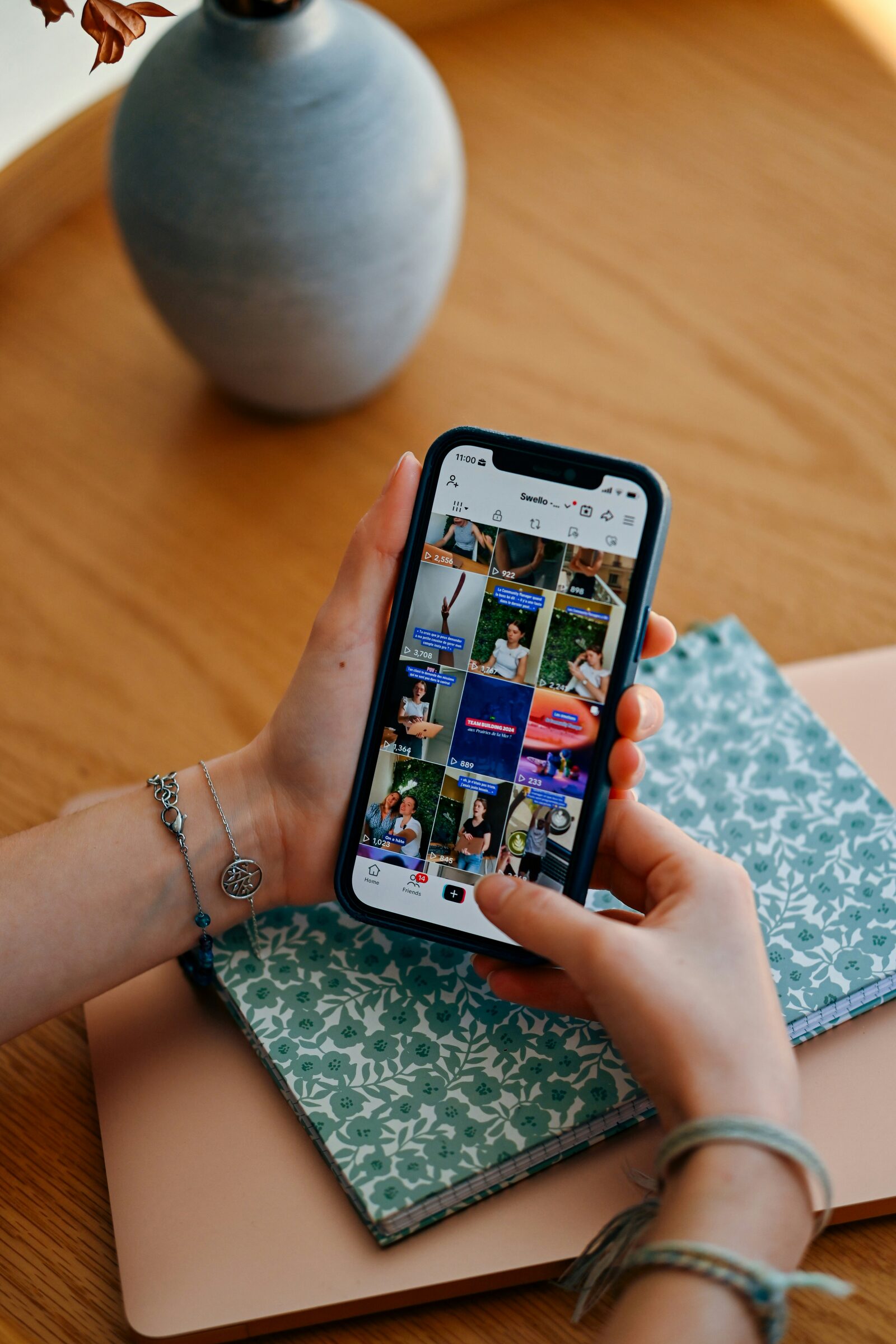 Phone showing a social feed